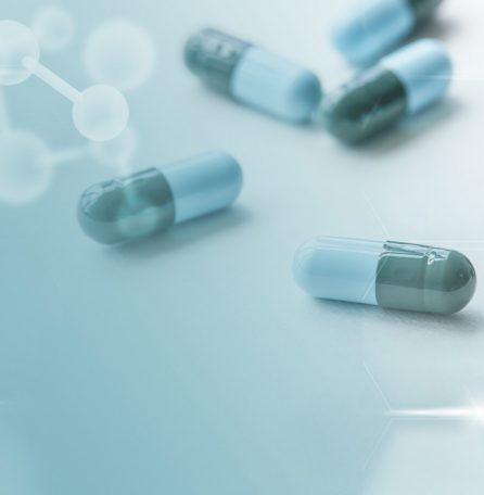 Medicine capsules global health with geometric pattern digital remix